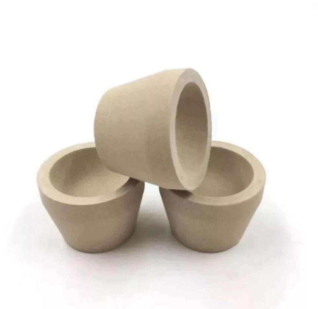Set of three tapered Mabor magnesia cupels for gold and silver refining, durable and heat-resistant, perfect for assaying.