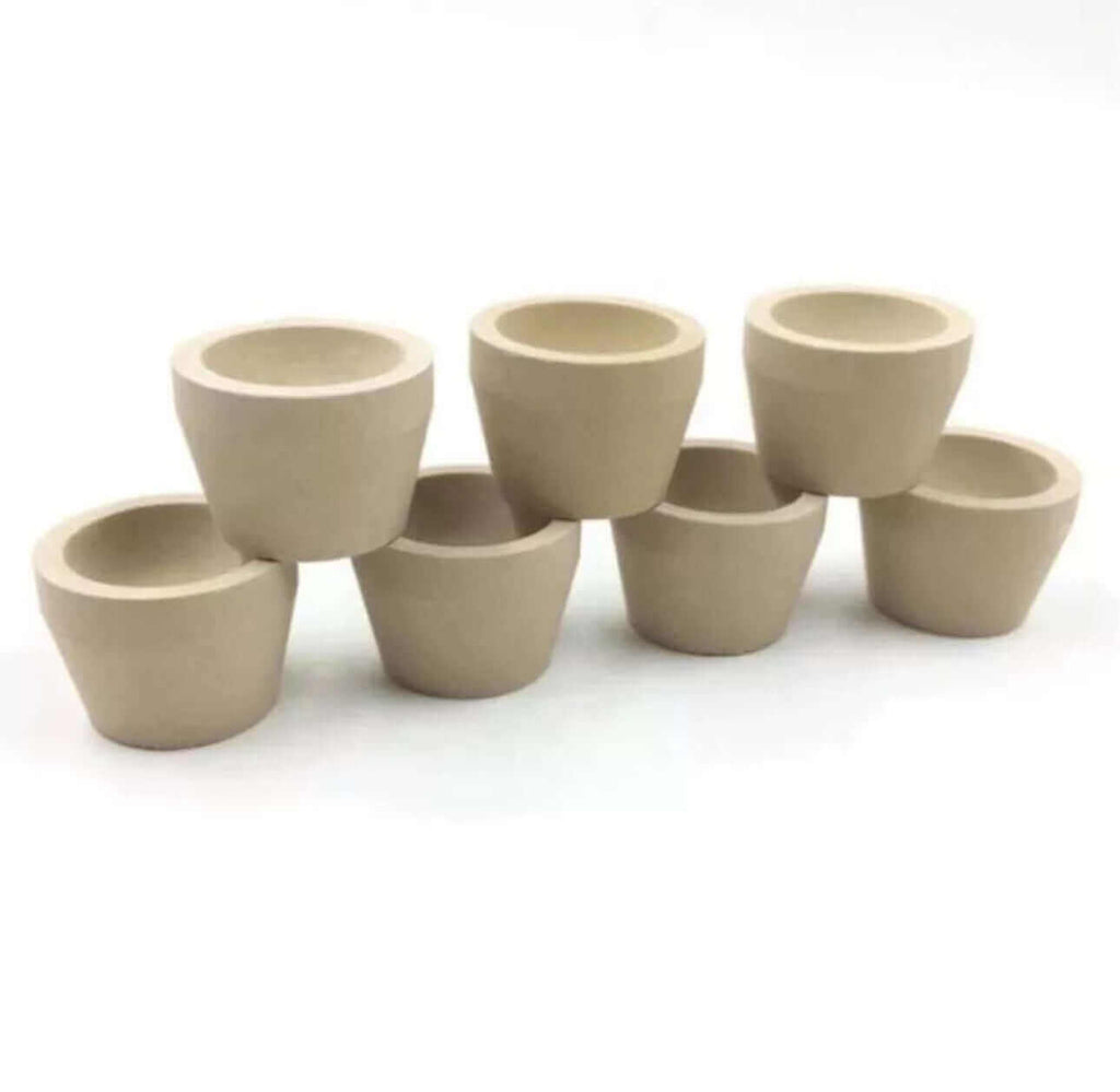 Set of Mabor Magnesia tapered cupels for gold and silver refining, featuring seven durable, heat-resistant pots.
