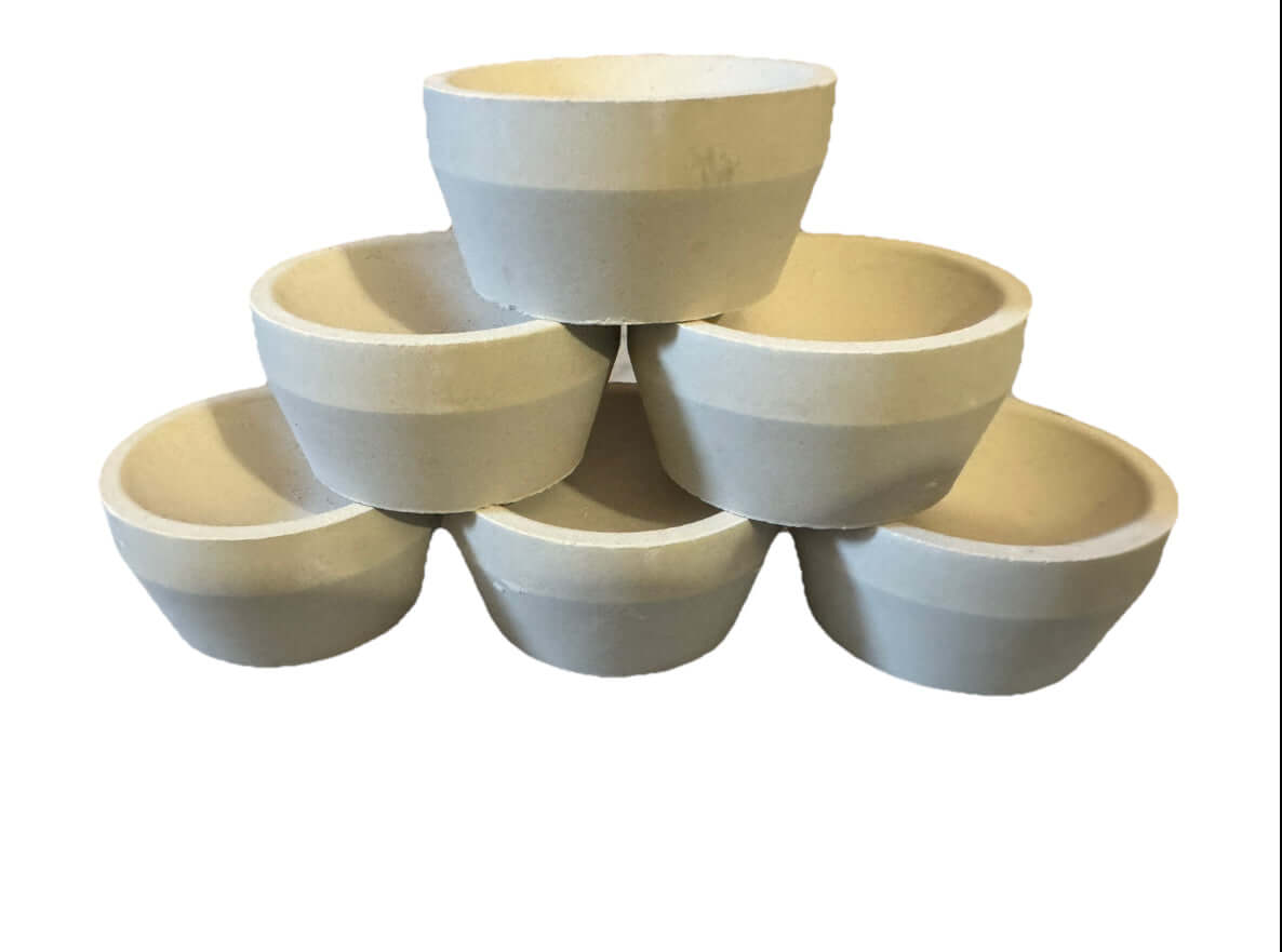 Stacked Mabor Magnesia Cupels set for gold and silver refining, showing six tapered cupels.