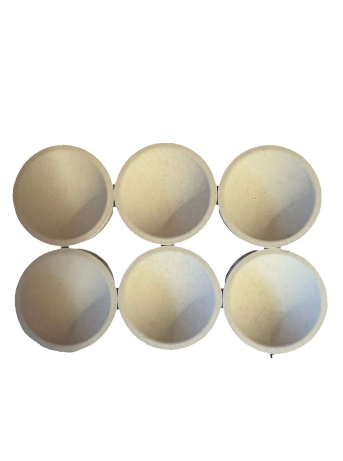 Set of six tapered Mabor magnesia cupels for gold and silver refining, showcasing effective impurity absorption.