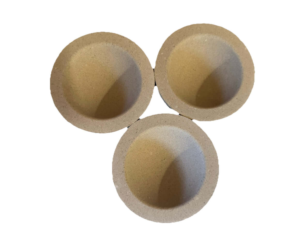 Set of three tapered Mabor magnesia cupels for gold and silver refining, designed for effective impurity absorption.