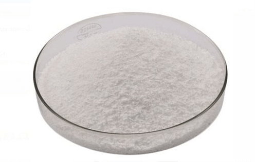 High purity Silver(I) Chloride powder in a glass dish, showcasing its fine white texture for chemical applications.